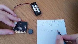 Microbit with magnets and recording sheet.
