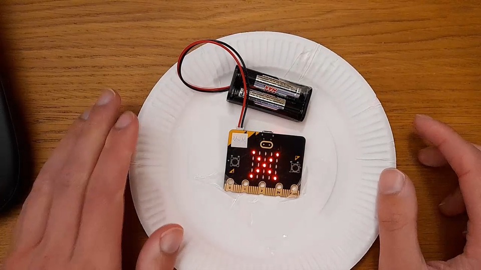 Picture of micro:bit on paper plate.