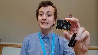 Picture of Mr Morrison holding a micro:bit with battery pack.